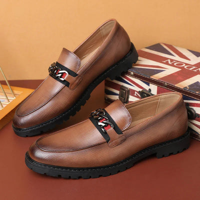 Brown leather loafers with chain detail and chunky soles from Henri Rousseau Deri