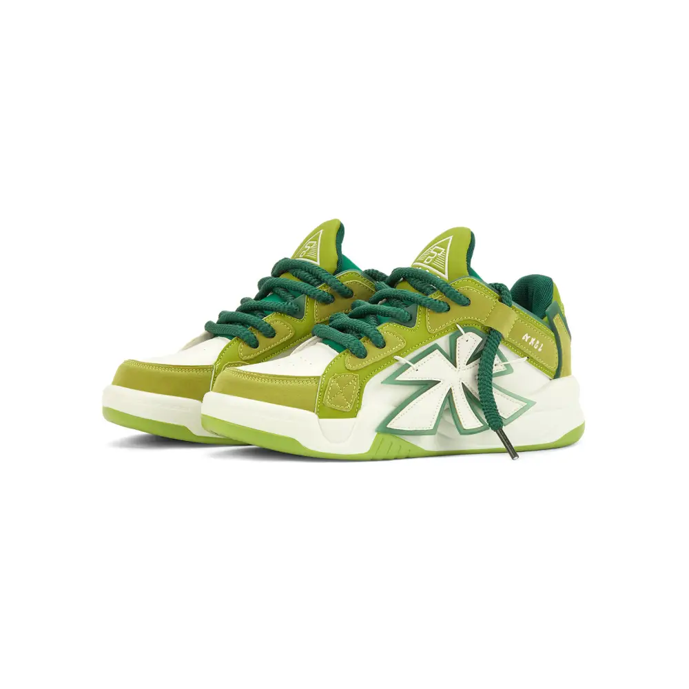 Jali unisex sneaker in green, yellow, and white with geometric design elements