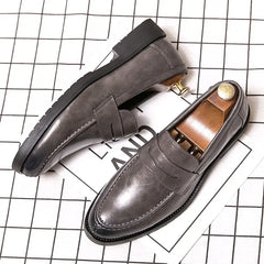 Gray leather penny loafers with contrast stitching from the Gradolino collection