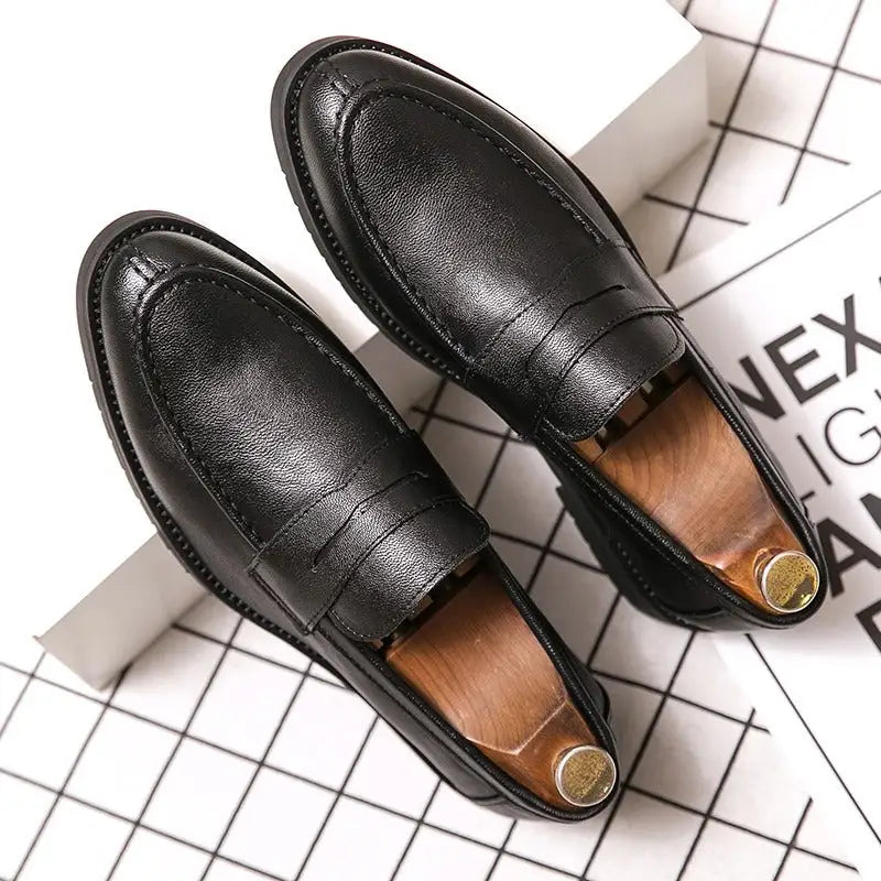 Black leather penny loafers with stitching detail, ideal for stylish bavin erkek loafer