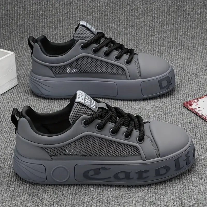 Gray athletic sneakers with black laces and mesh detailing from Ravelle Erkek Spor